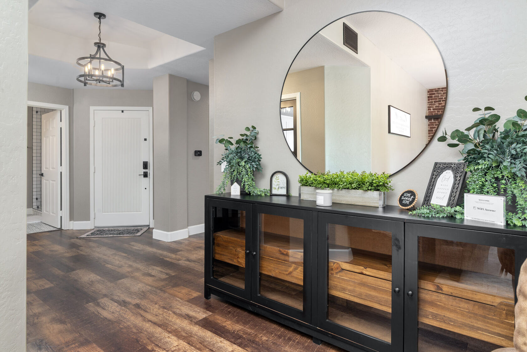 The Hawk's Rest entry foyer with console and round mirror