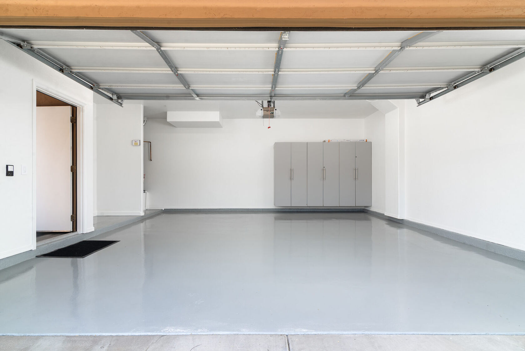 Private one-car garage with epoxy floor and storage